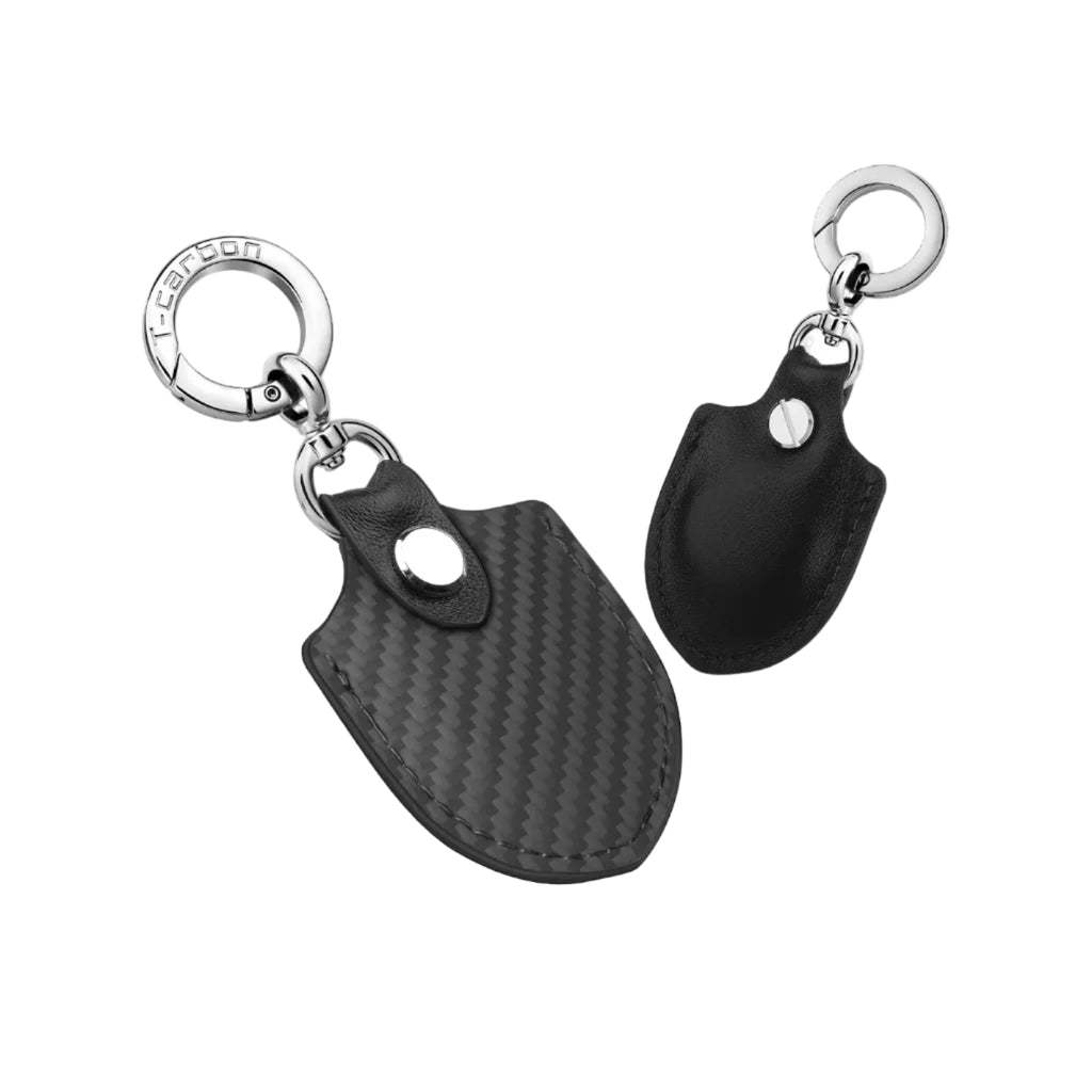 Black carbon fiber and leather AirTag keychain holder, front and back views